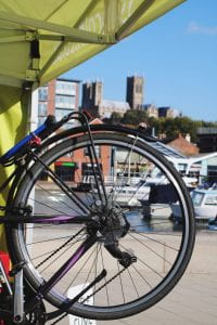 Image of a bike wheel with a church in the background