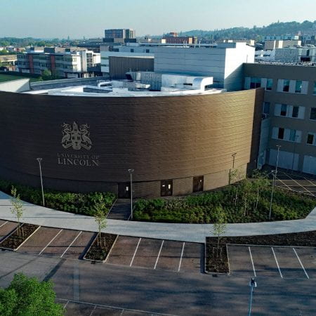 Image of a large curved building from above