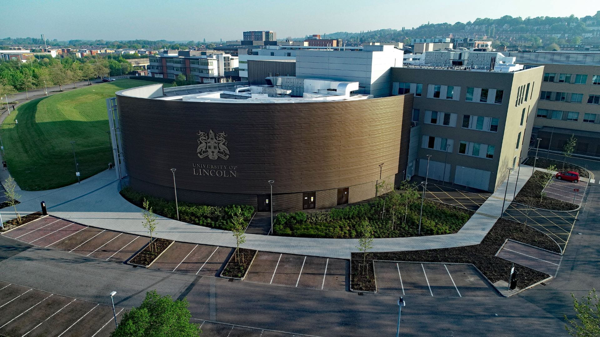 Image of a large curved building from above