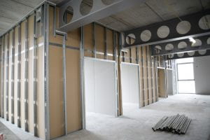 Image of a room that is under construction, the walls and ceiling bars are visible