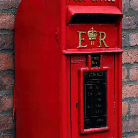 Image of a red post box on a wall