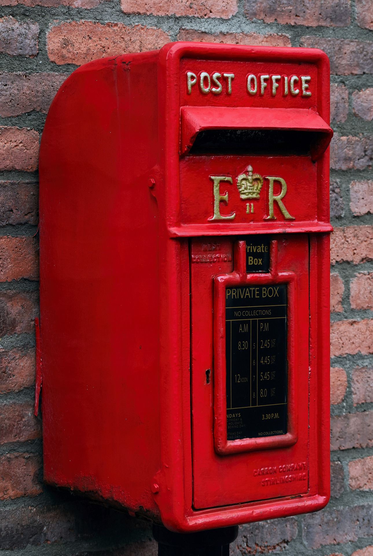 Image of a red post box on a wall